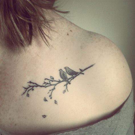 symbolic bird tattoos|bird on a branch tattoo.